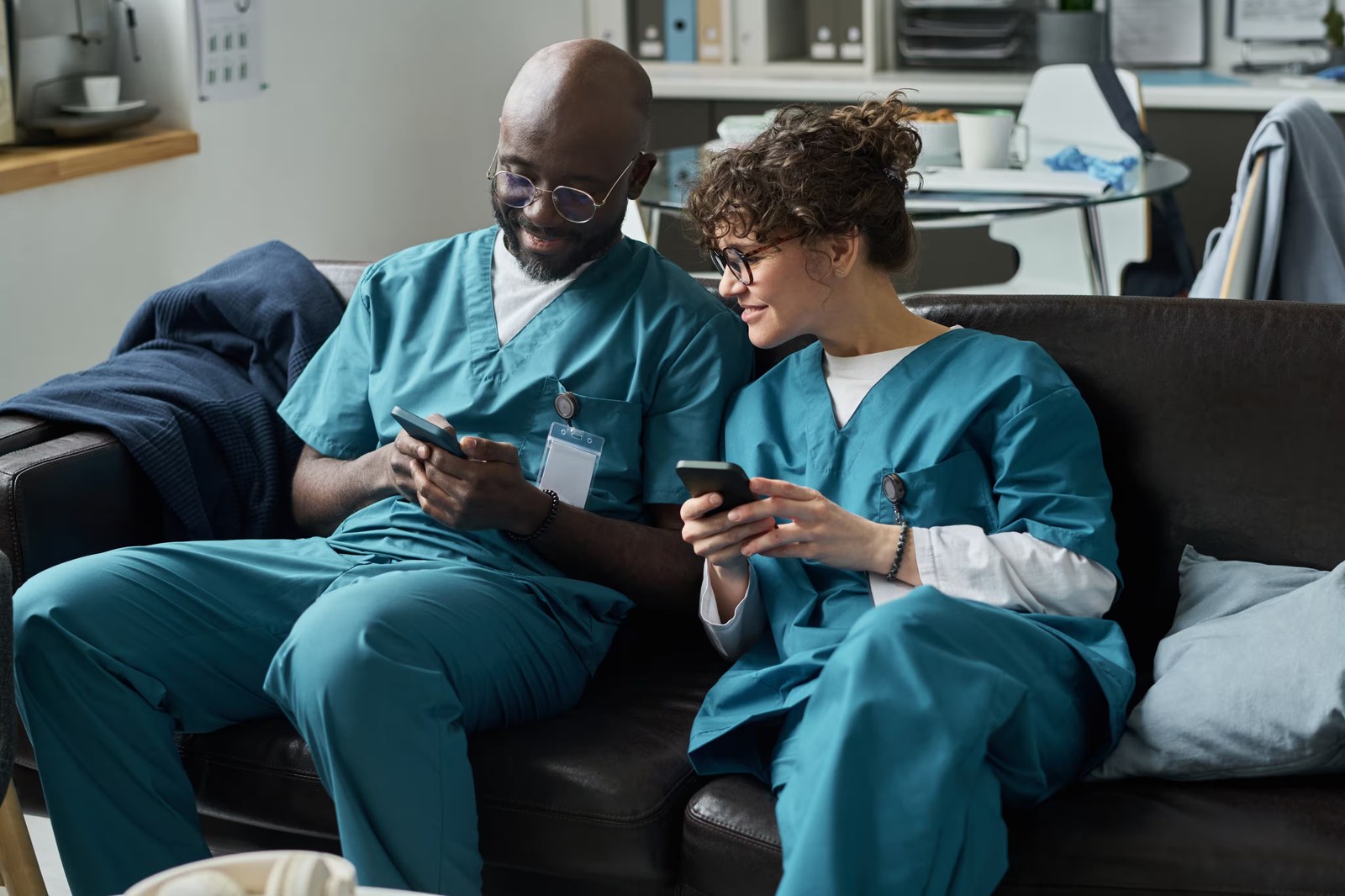 A caregiver checking Caily on a phone between rooms